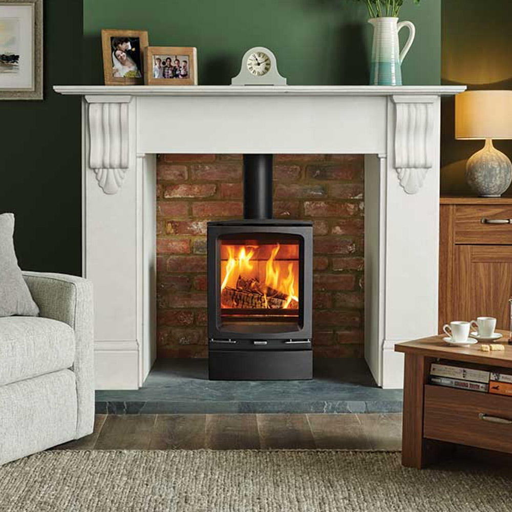 wood burning stove in victorian fireplace